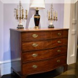 F69. Antique English mahogany serpentine chest of drawers. 